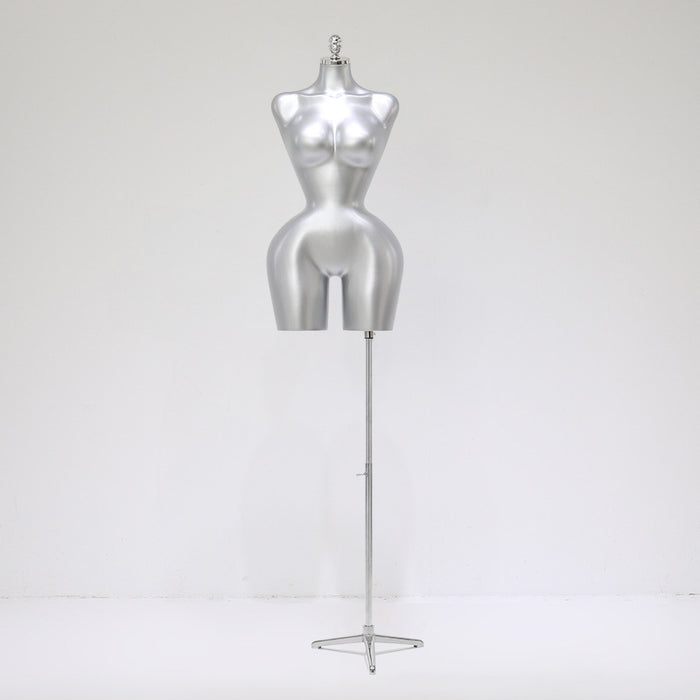 Silver mannequin torso on a stand against a white background