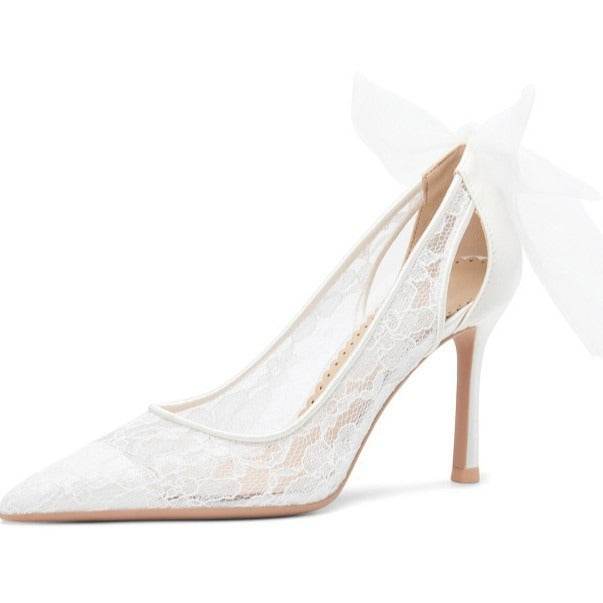 White lace high-heeled shoe on a white background