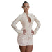 Woman wearing a white lace dress on a white background
