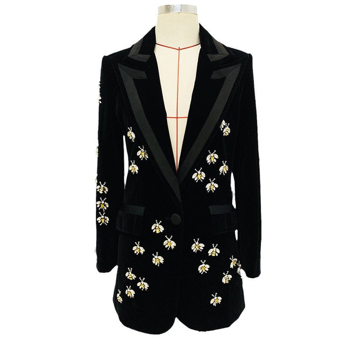 Black blazer with bee embroidery on a mannequin against a white background