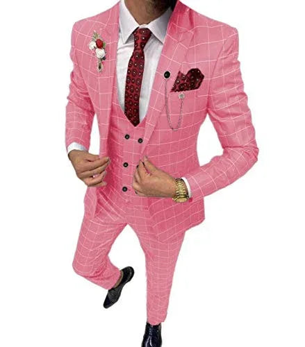 Man wearing a pink checkered suit with a white shirt and red tie on a white background