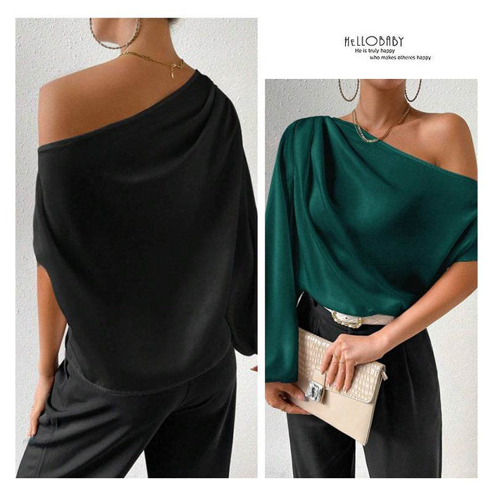 Two women wearing one-shoulder dresses in black and green, with a visible brand logo on the right.