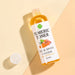Bottle of Tumeric Toner on a beige background