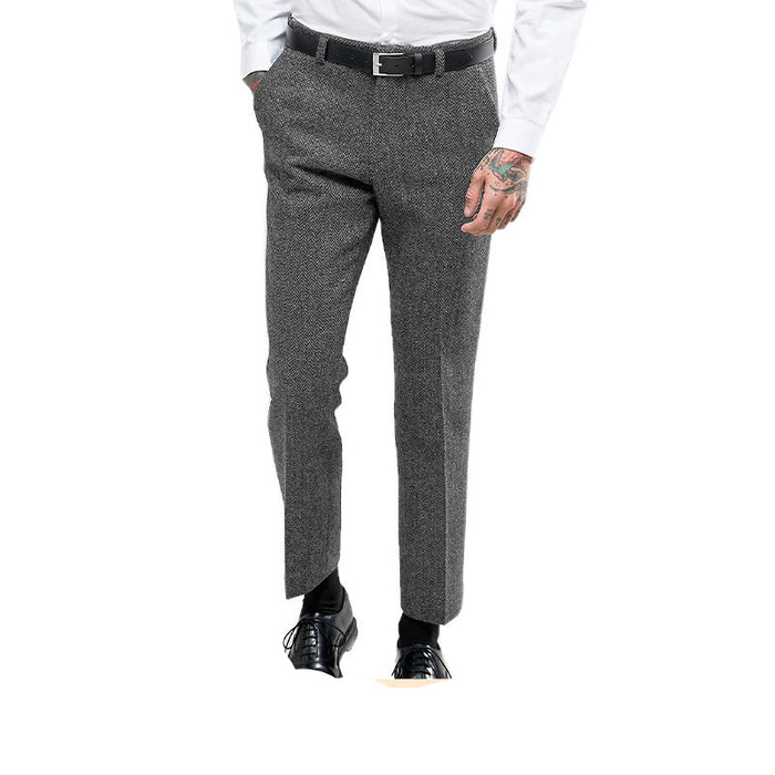 Gray suit pants worn with a white shirt on a white background