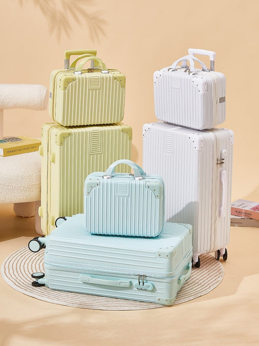 Set of pastel-colored suitcases on a beige background