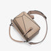 Beige handbag with geometric design on a white background