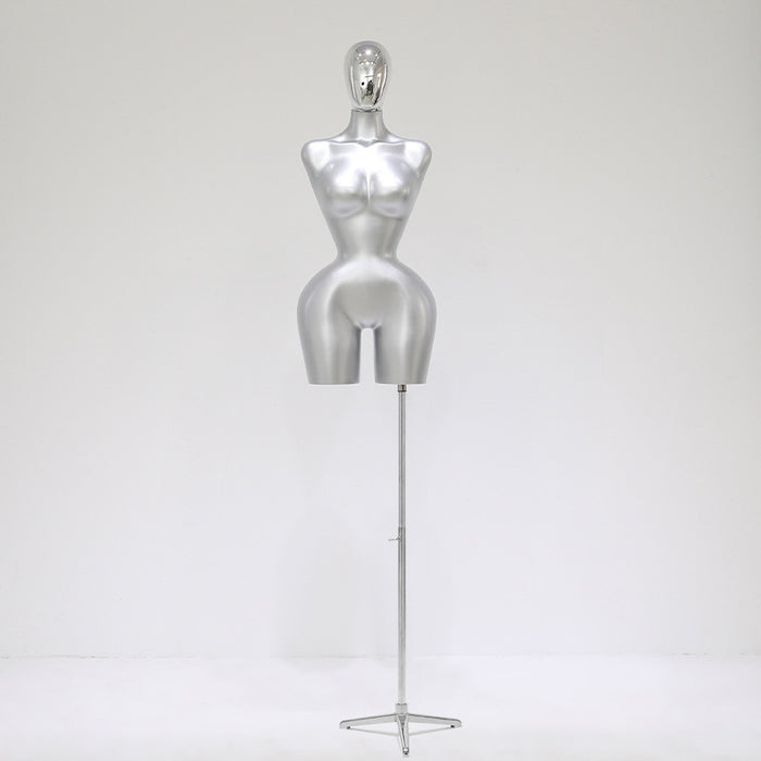 Silver mannequin on a stand against a white background