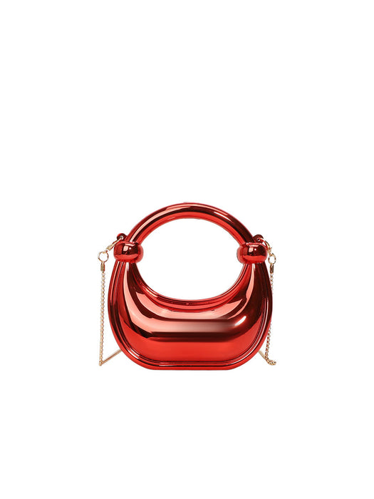 Red handbag with a chain strap on a white background