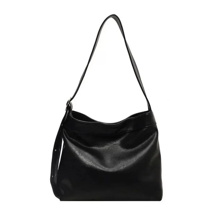 Black leather handbag on a white background