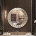 Round decorative mirror on a wall with a bathroom reflection
