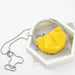 Yellow handbag with a chain strap on a white background