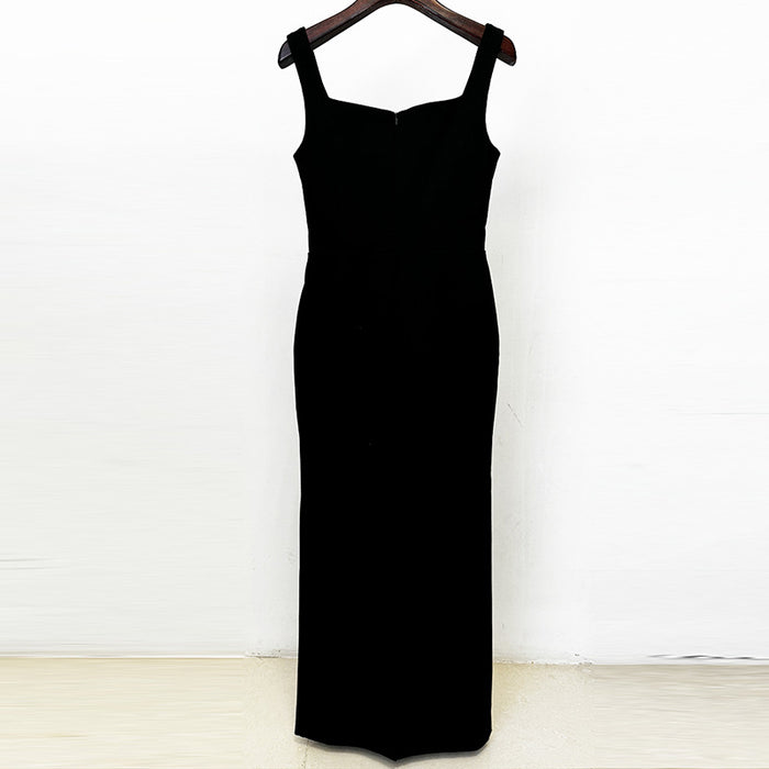 Black dress on a hanger against a white background