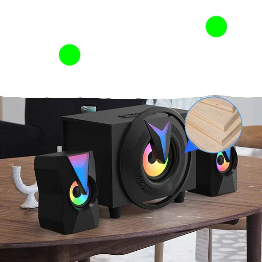 Black speaker system with rainbow lighting on a wooden table, surrounded by furniture.