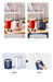 Portable blender with different color options on a wooden surface.
