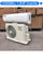 Air conditioning unit with technical specifications displayed on a concrete floor.