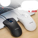 Two ViewSonic computer mice on a desk with a laptop in the background.