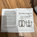 Slivers Priest rice cooker instruction manual on a wooden surface