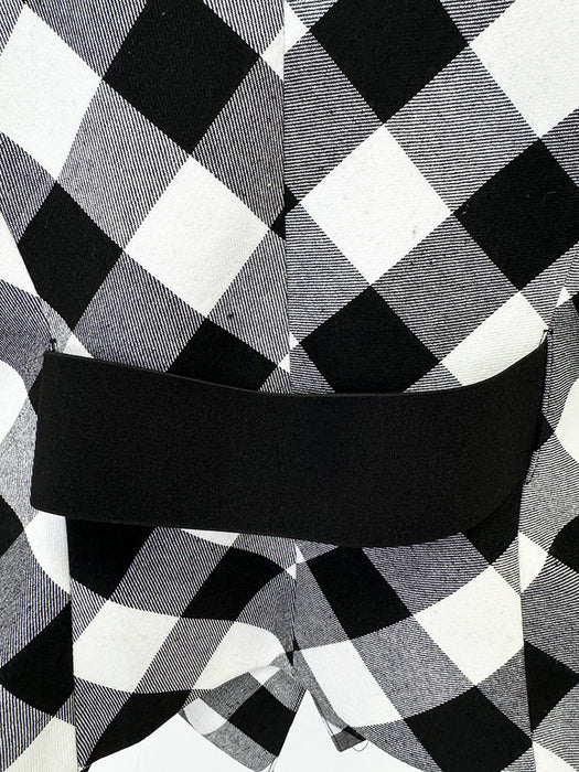 Black and white checkered fabric with a belt