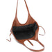 Brown leather handbag with a black interior on a white background