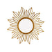 Decorative gold sunburst mirror on a white background