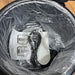 Electrical components and packaging in a trash bin