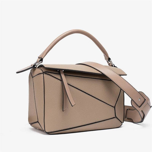 Beige handbag with geometric design on a white background