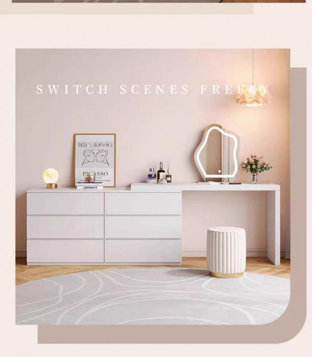 Modern bedroom setup with a dresser, mirror, and decor elements.