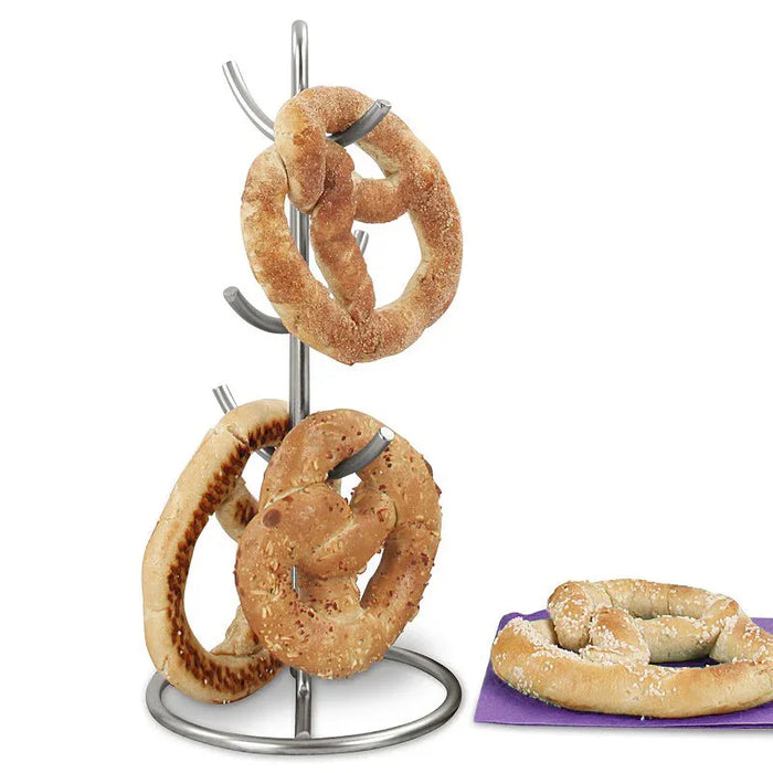 Metal pretzel holder with pretzels on a white background