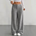 Gray wide-leg pants worn by a person on a plain background