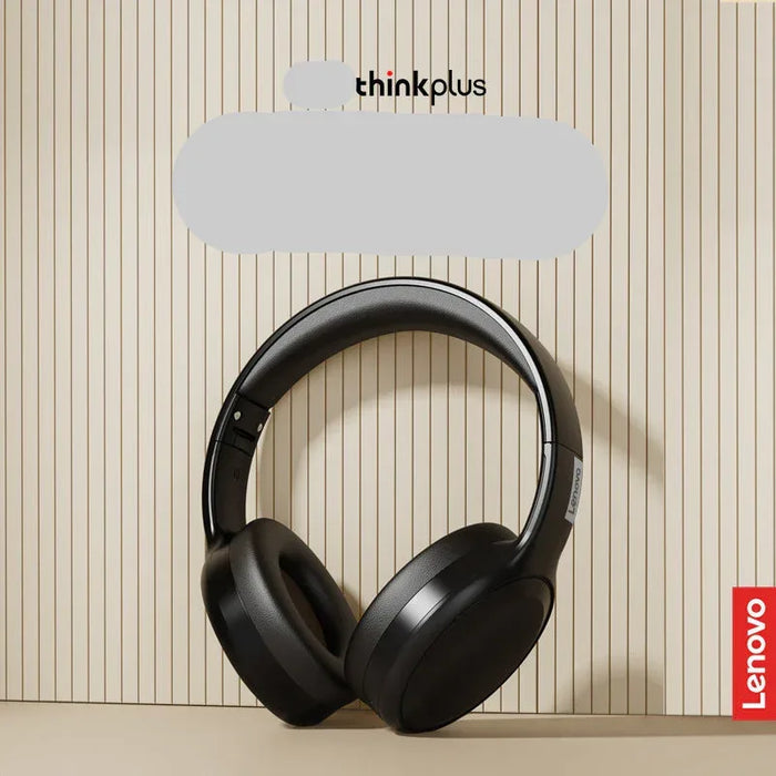 Black headphones on a beige background with Lenovo branding