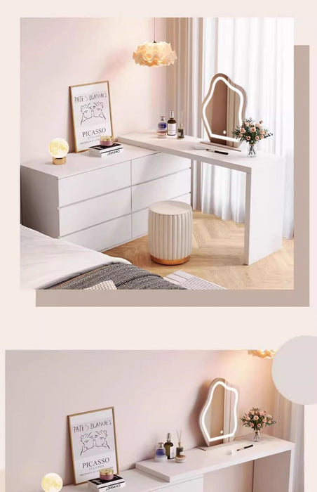 Modern bedroom setup with a vanity table, mirror, and decor items.
