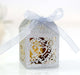 Decorative gift box with a white ribbon on a blurred background