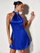 Woman wearing a blue dress against a white background