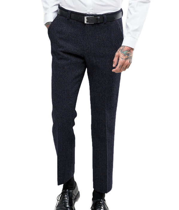 Dark gray pants worn by a person on a white background