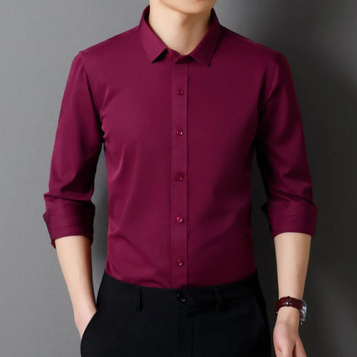 Maroon dress shirt worn by a person on a gray background