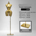 Gold female mannequin with specifications on a gray background