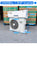 Air conditioning unit with dimensions and specifications displayed on a concrete floor.