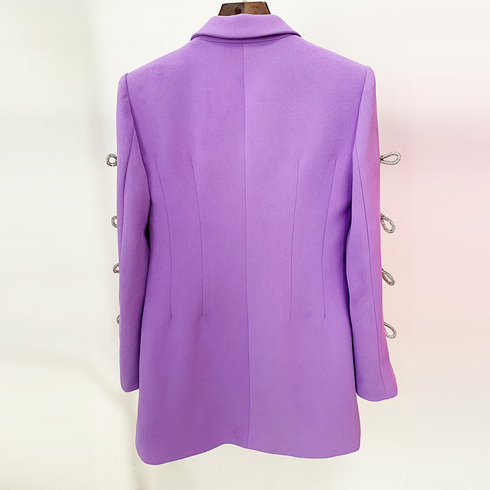 Purple coat with silver buttons on a white background