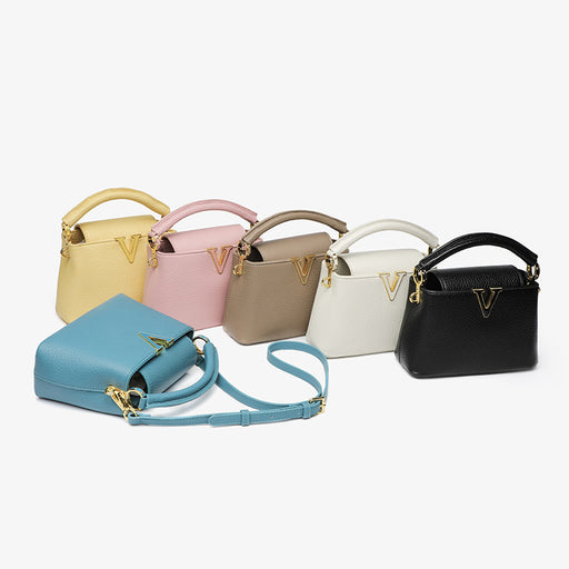 Set of six handbags in various colors on a white background