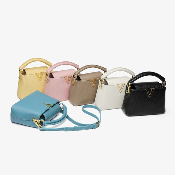 Set of six handbags in various colors on a white background