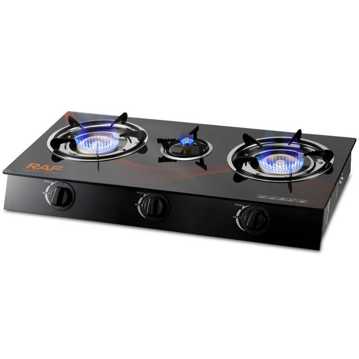 Black three-burner gas stove with blue flames on a white background