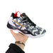 Basketball shoe with floral pattern held by a hand on a white background