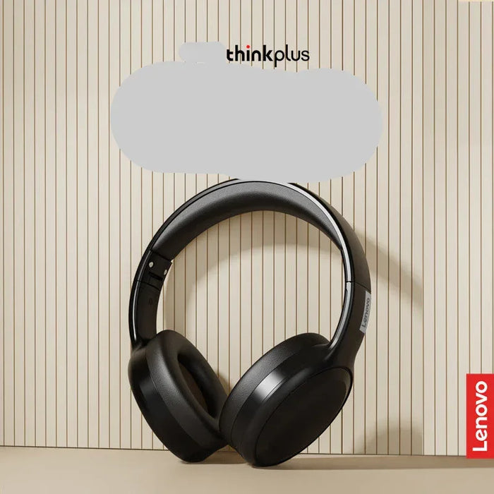 Black headphones on a beige background with Lenovo branding