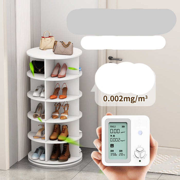 Rotating shoe rack with shoes on shelves and a digital air quality meter being held.