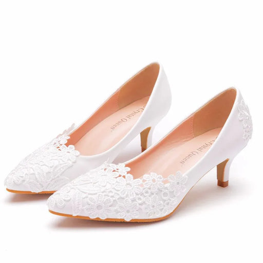 White lace wedding shoes on a white background