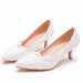 White lace wedding shoes on a white background