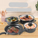 Set of cookware with non-stick coating on a wooden surface