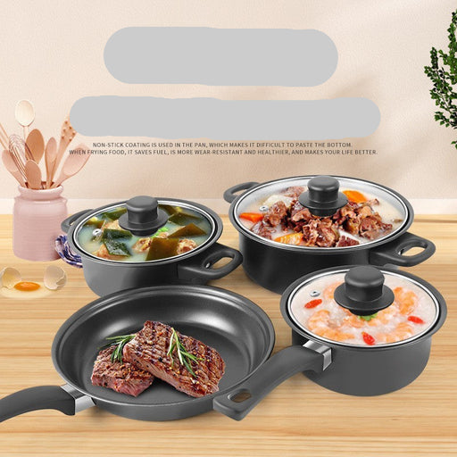 Set of cookware with non-stick coating on a wooden surface