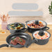 Set of cookware with non-stick coating on a wooden surface