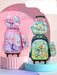 Two children's backpacks with cartoon designs on a pink and blue platform.